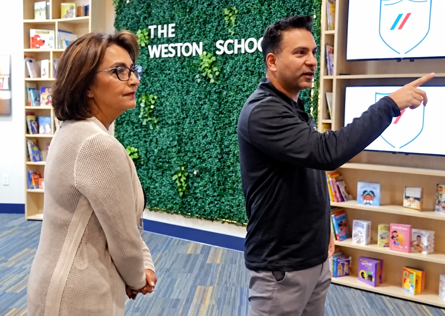 Omar Khan showing his mother Nazli Khan through The Weston School today
